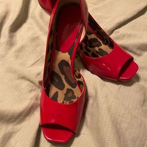 Red Jessica Simpson stilettos.
